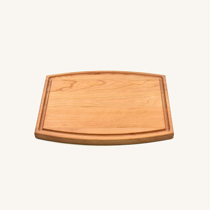 Tabla de cortar de madera arqueada con ranura para jugo